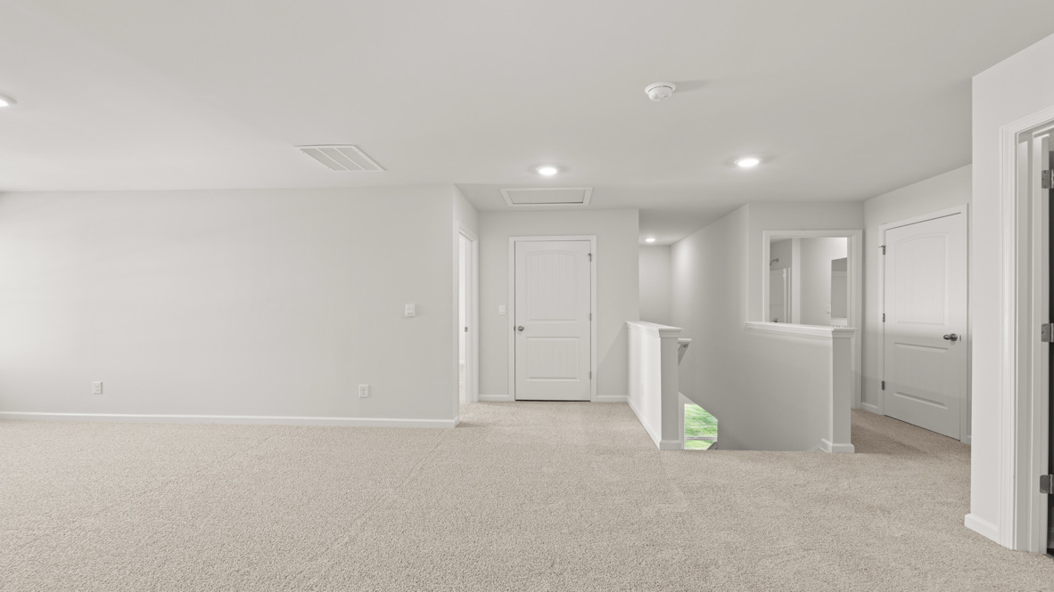 Interior upstairs loft area open to staircase