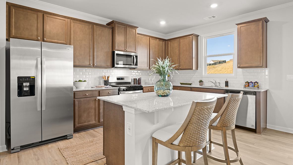 Interior kitchen with center island and wooden cabinets