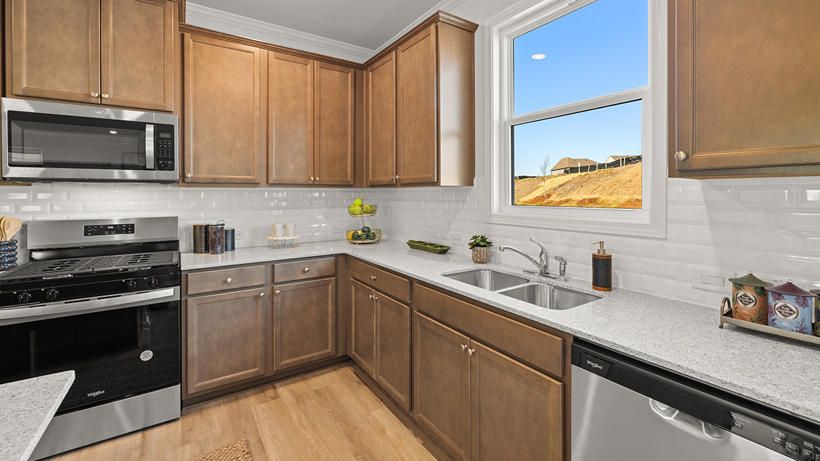 Interior kitchen with window and wooden cabinets