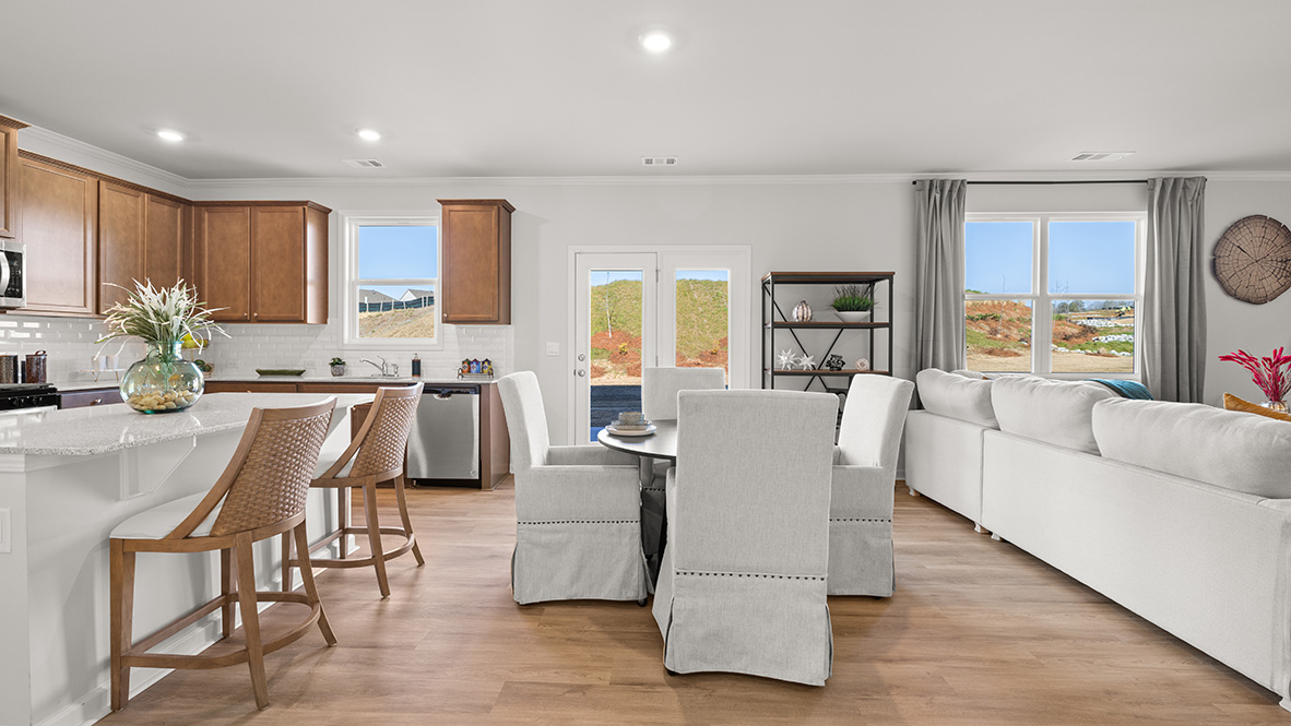 Interior kitchen with center island open to dining and living area