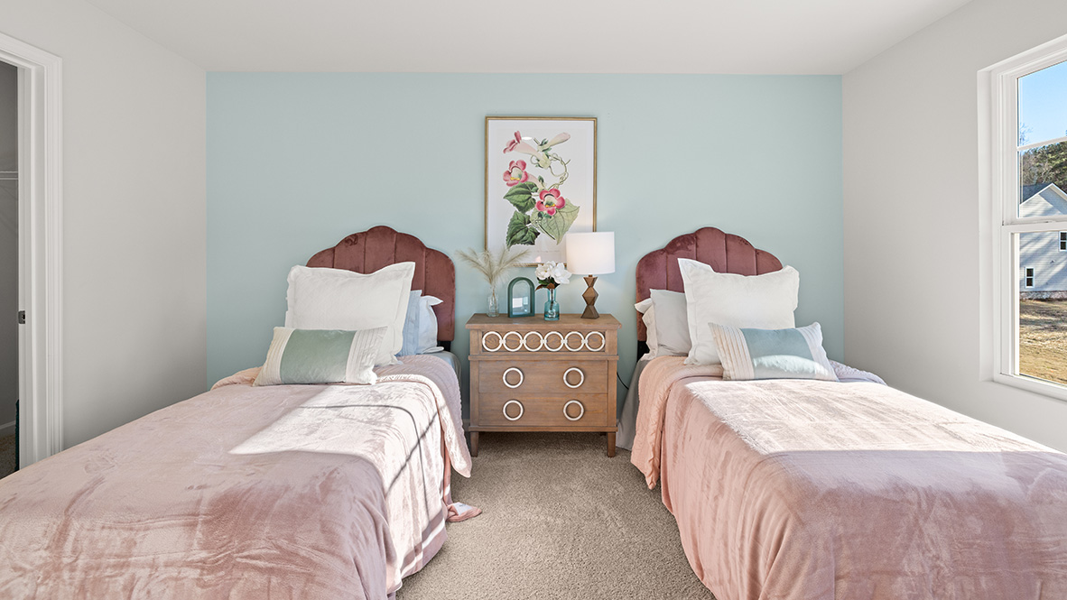 Interior upstairs bedroom with window and accent wall