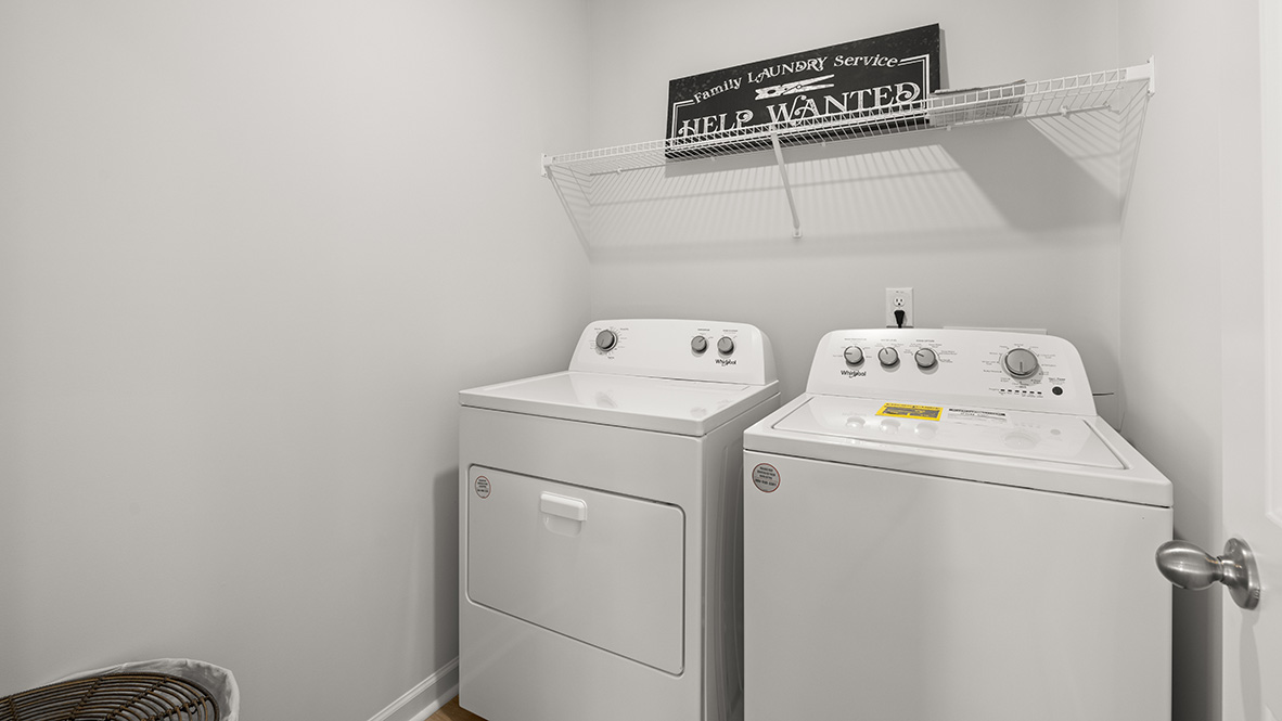 Interior Interior laundry room with double sink and full-sized shower