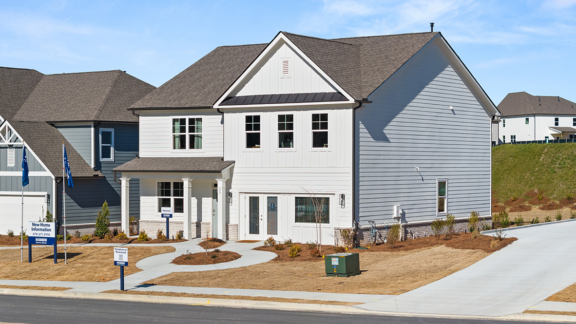 Exterior white two-story home with stone detailing