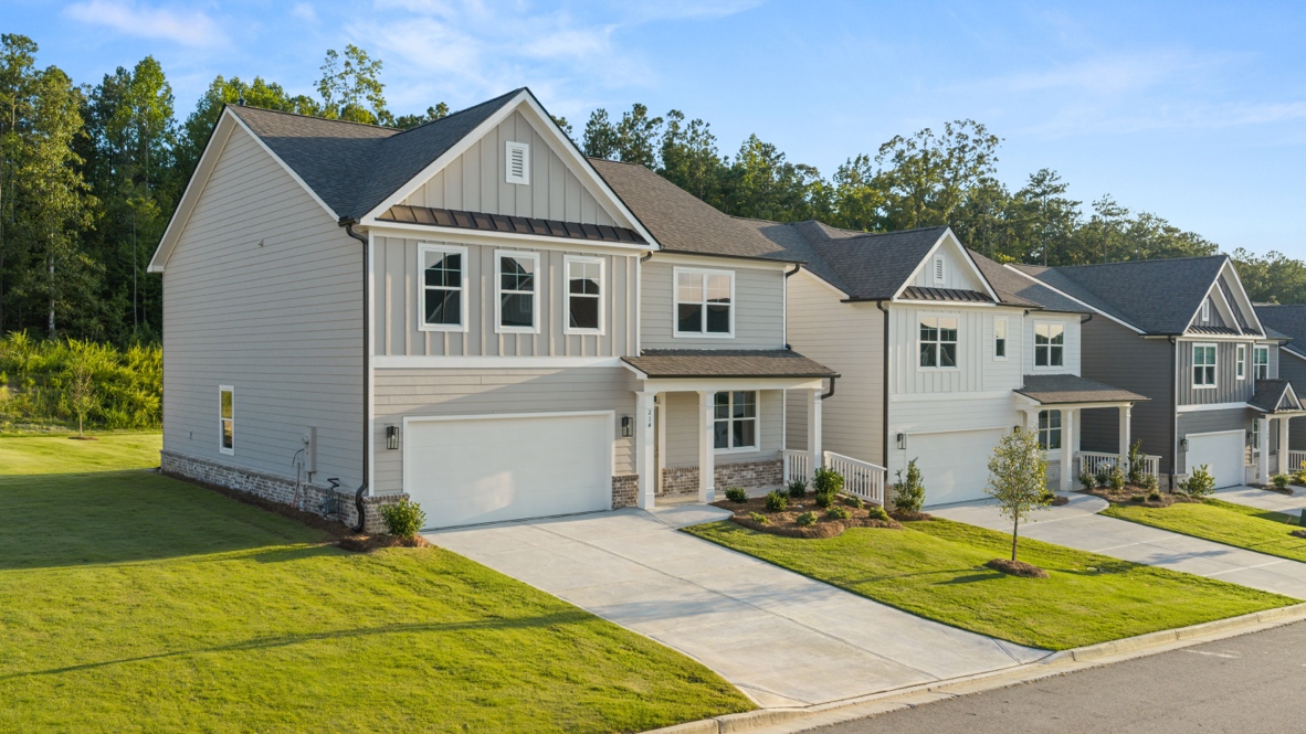 Front exterior of the Hanover floorplan at Hamptons at Riverwood South in Dallas, GA