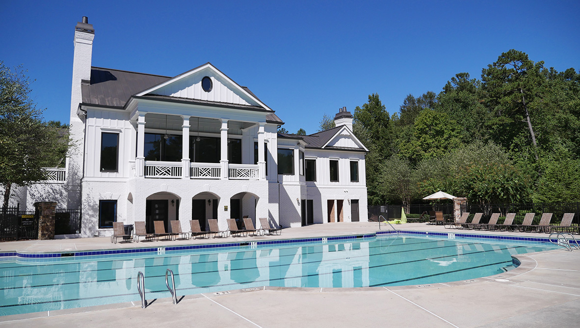 Community clubhouse and resort-style pool in the Hamptons at Riverwood in Dallas, GA