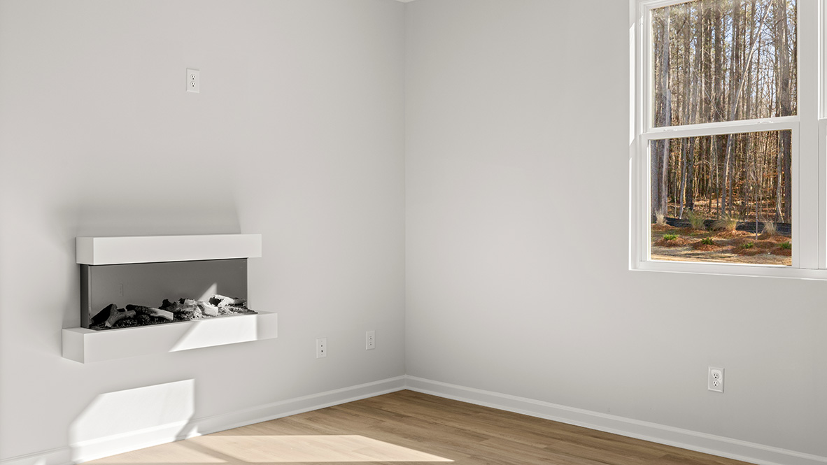 Interior living area with fire place and large windows