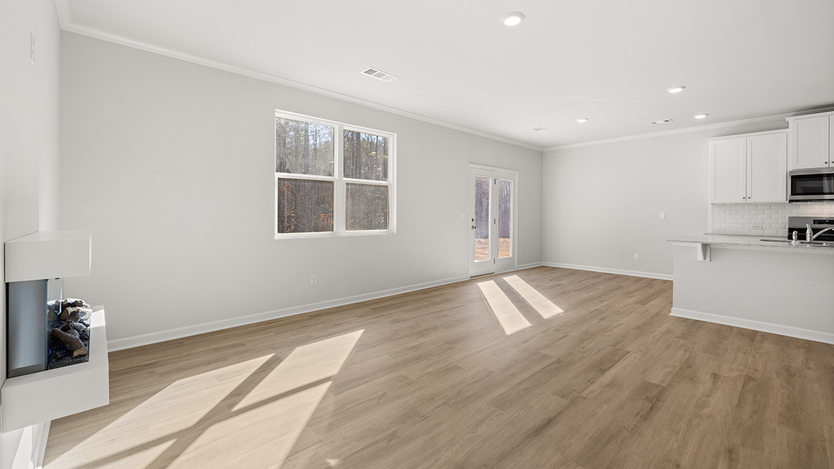 Interior living area with fire place and large windows