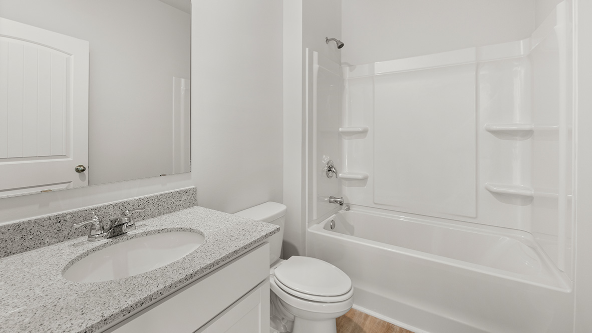Interior bathroom with sink and full-sized shower