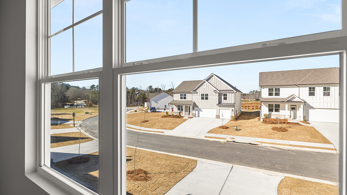 Interior primary bedroom with large window