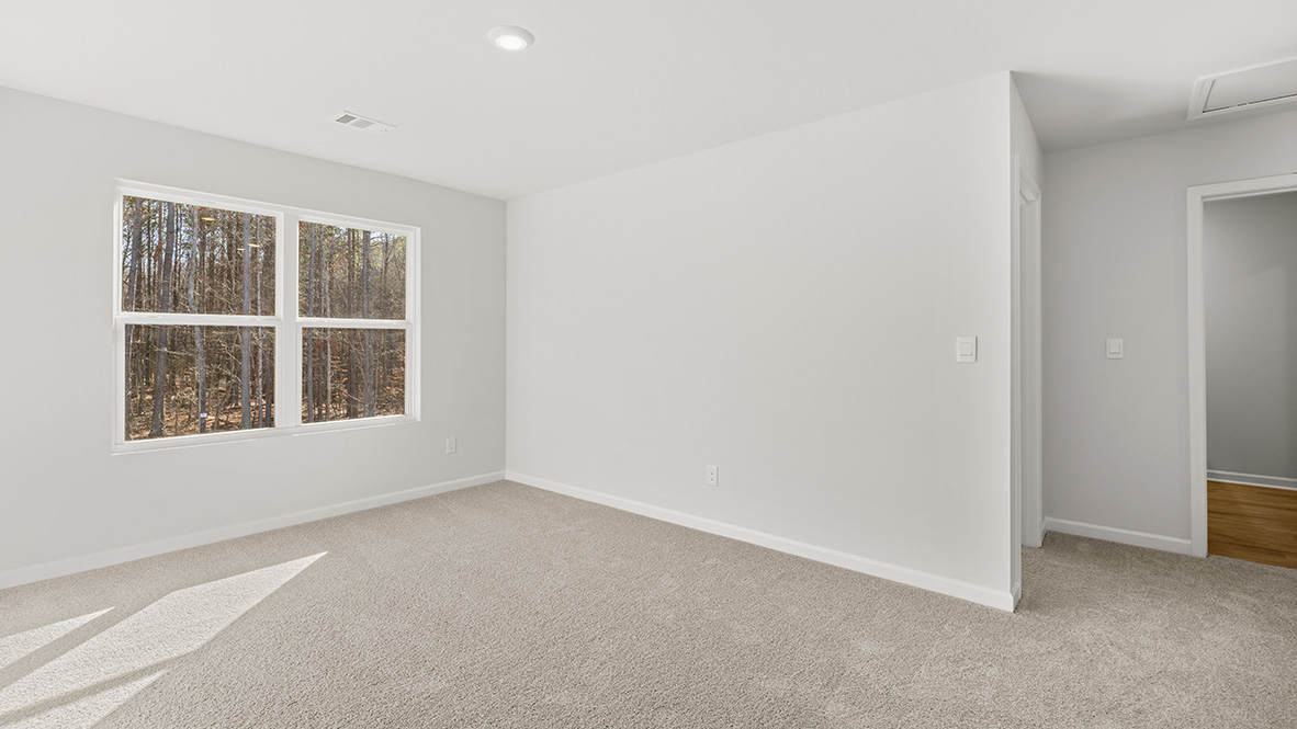 Interior upstairs loft area with large window