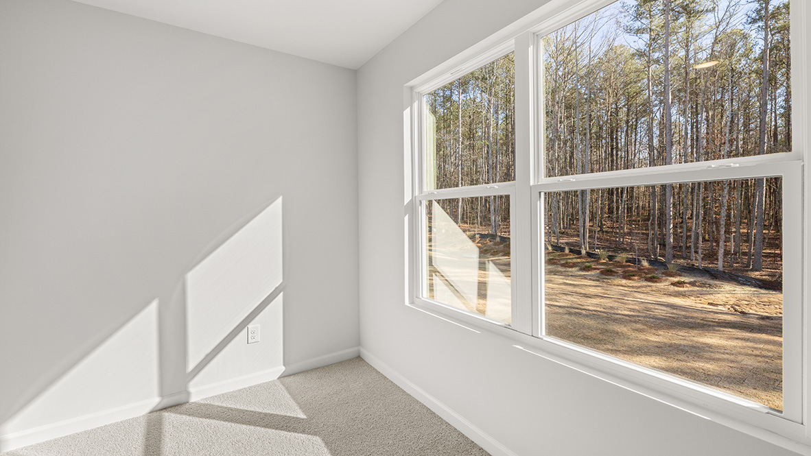 Interior upstairs loft area with large window