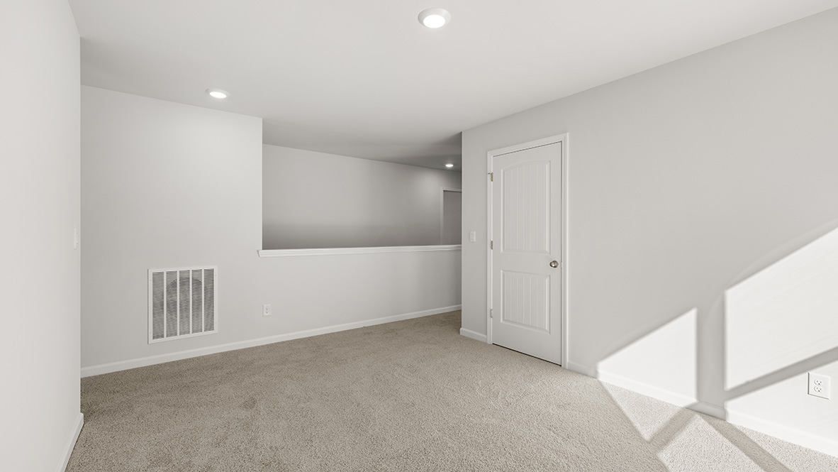 Interior upstairs loft area open to staircase