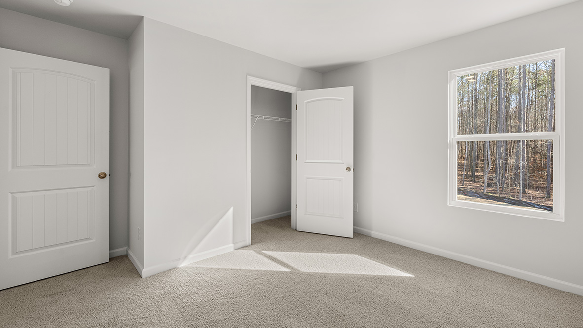 Interior bedroom with window and closet