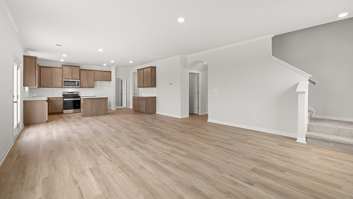 Interior living area open to staircase and kitchen