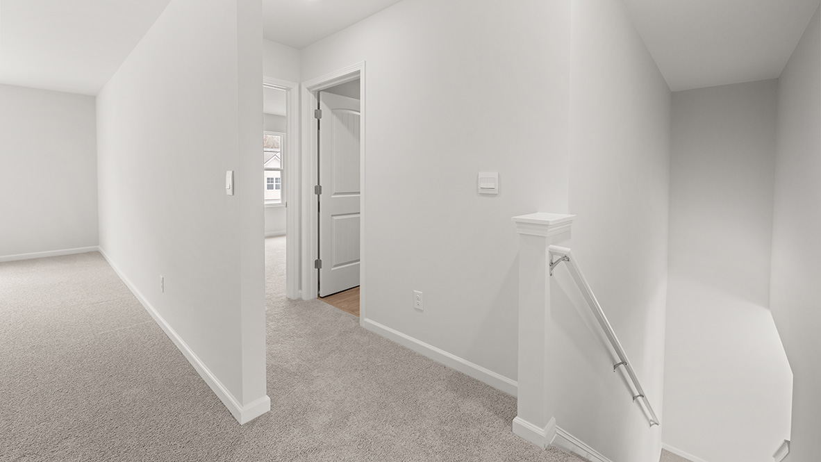 Interior upstairs loft area open to staircase