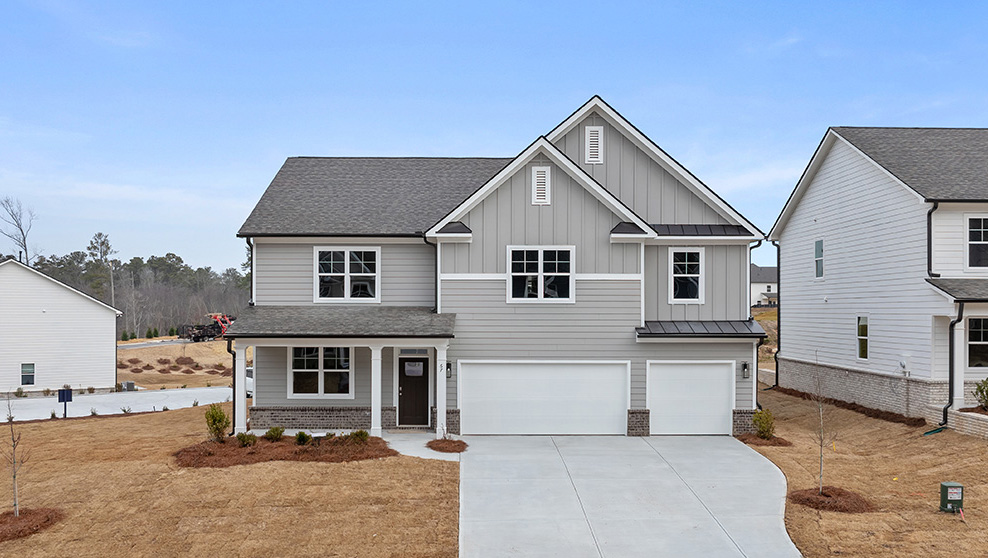 Front exterior of the Mansfield floorplan at Hamptons at Riverwood South in Dallas, GA