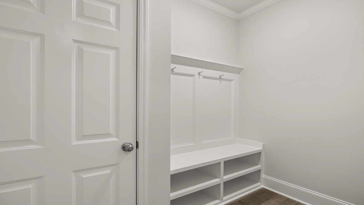 Surprising Mud Room crafted by D.R. Horton includes storage windows, durable flooring, and easy flow to the kitchen and garage