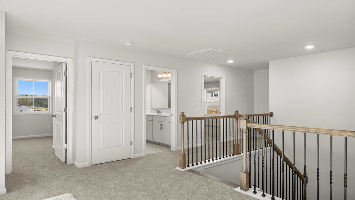 Loft or Bedroom Open layout upstairs features loft flowing into secondary bedroom, ideal for multipurpose use