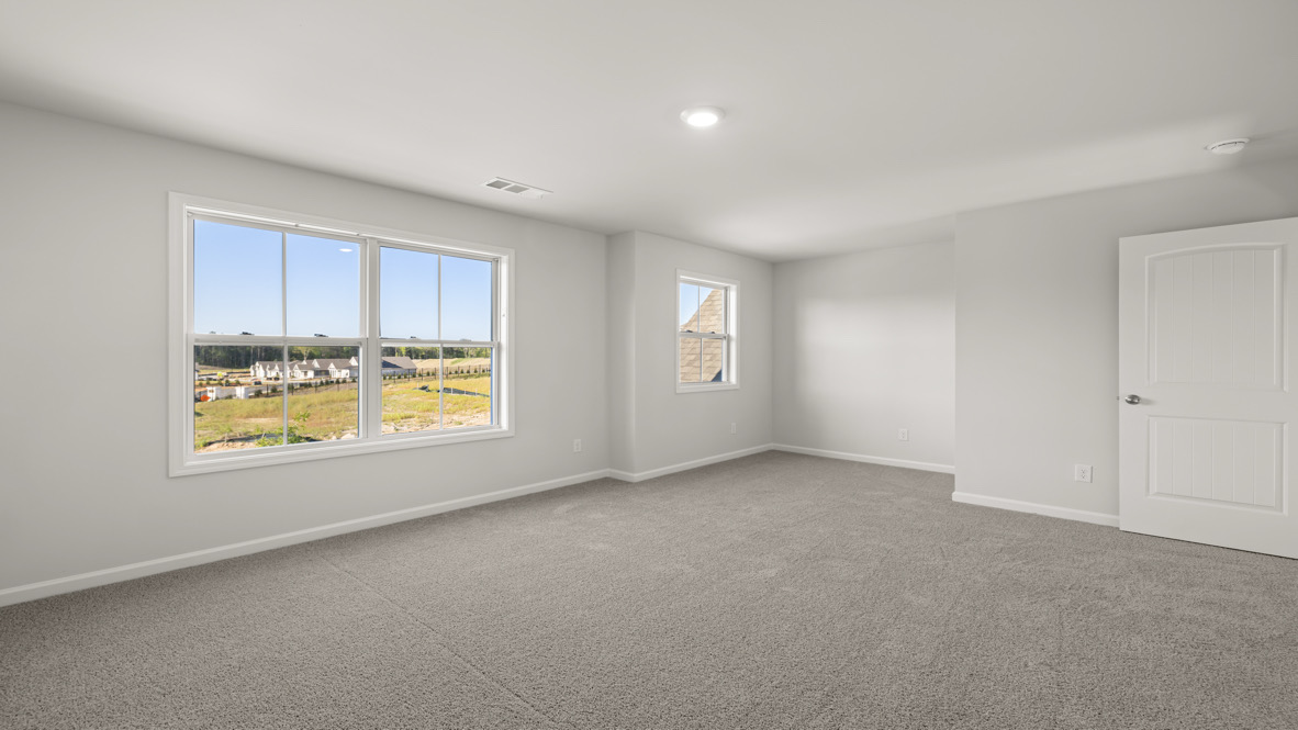 New Home For Sale showcases a D.R. Horton en suite bathroom with sleek tile flooring, open layout, and adjacent walk-in closet