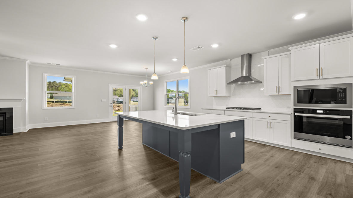 Kitchen island in D.R. Horton New Home For Sale includes seamless integration with dining area and Open Concept floorplan