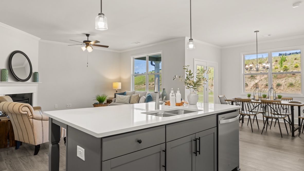 Interior kitchen with center island and white cabinets
