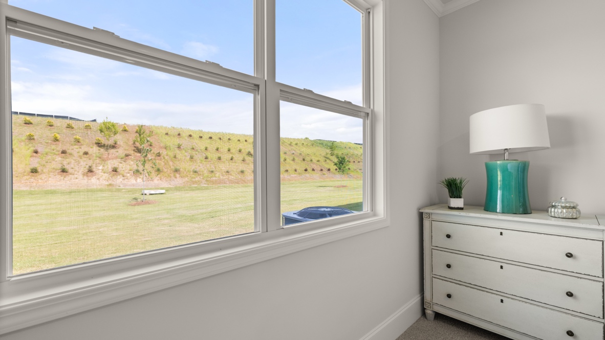 interior primary bedroom with view to back yard