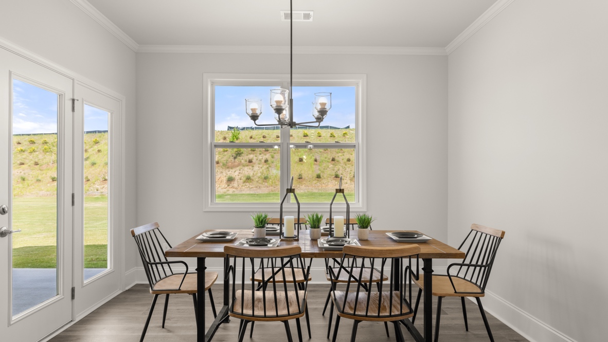breakfast area off of kitchen with doors to back patio