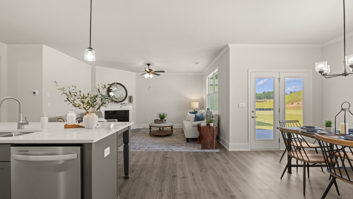 dining area looking into open kitchen and living room
