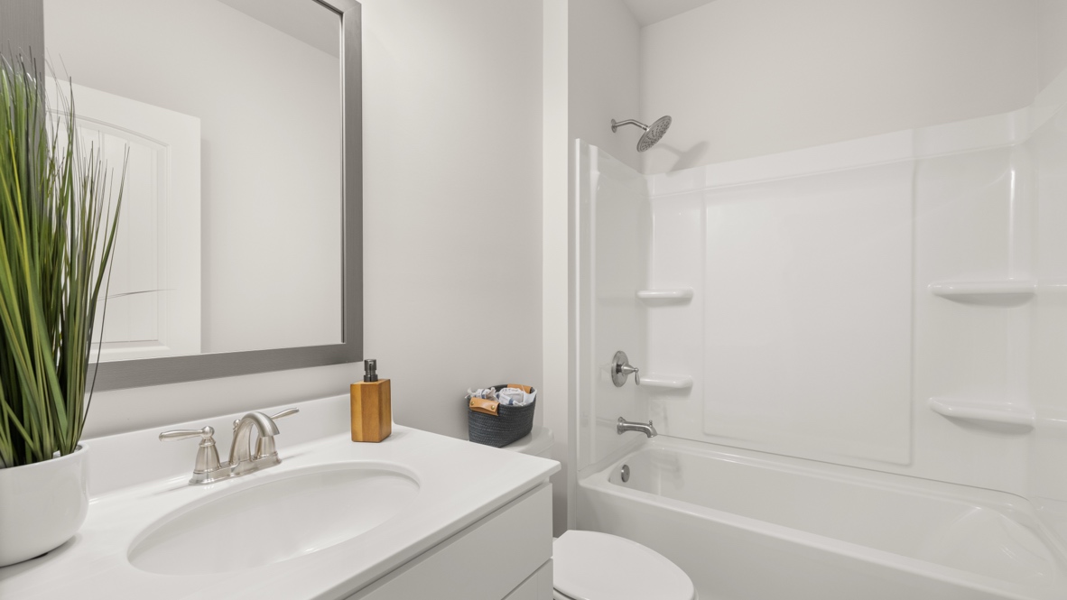 Bathroom with shower, toilet and sink.