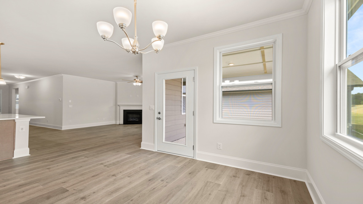 Interior dining area with large window open to kitchen