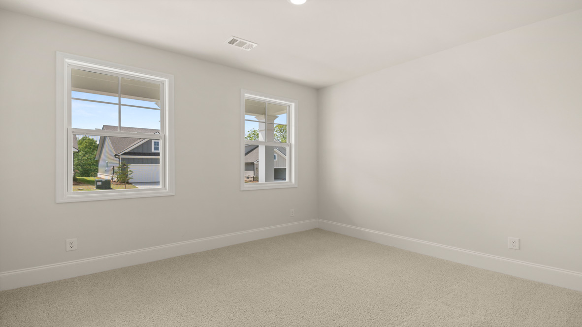 Interior bedroom with two windows