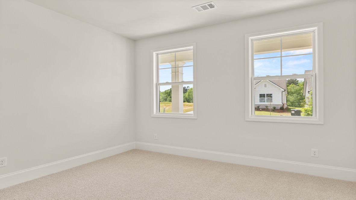 Interior bedroom with two windows