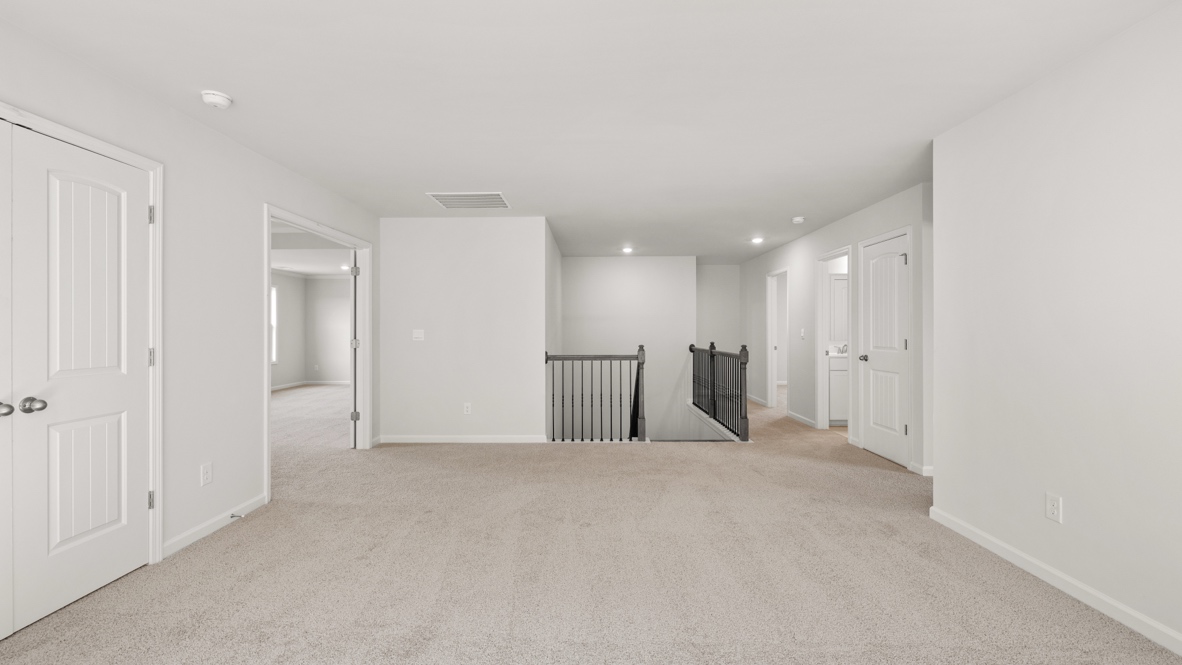 Interior upstairs loft area open to staircase