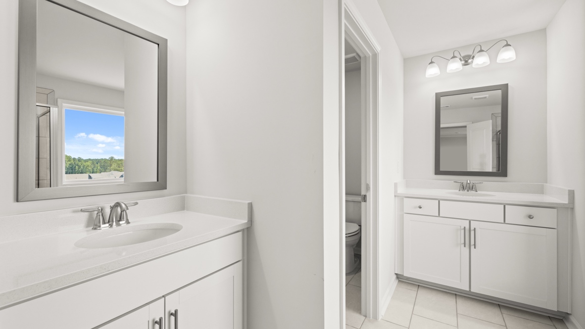 Interior primary bathroom with sinks