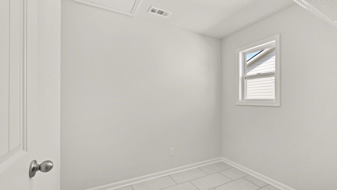 Interior laundry room with window