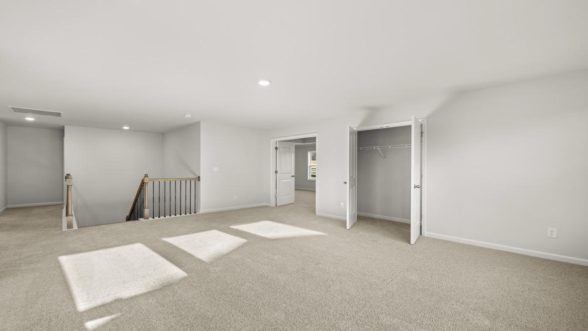 Interior upstairs loft area with large windows