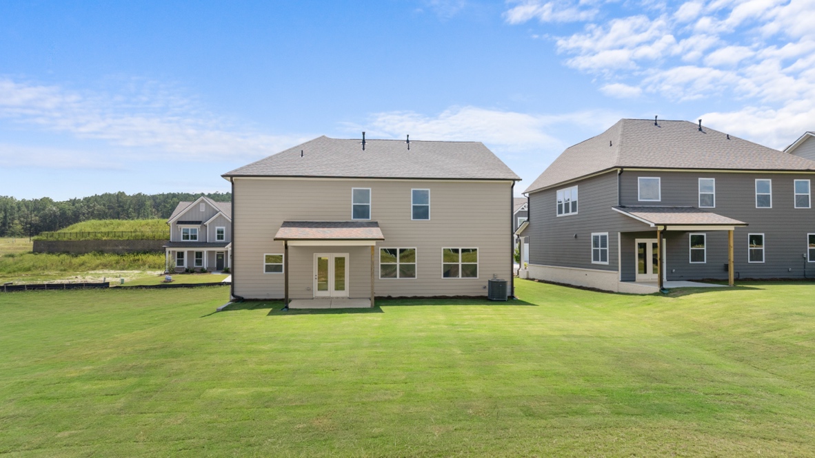 The Grayson Backyard Patio View with rear elevation of Hamptons at Riverwood