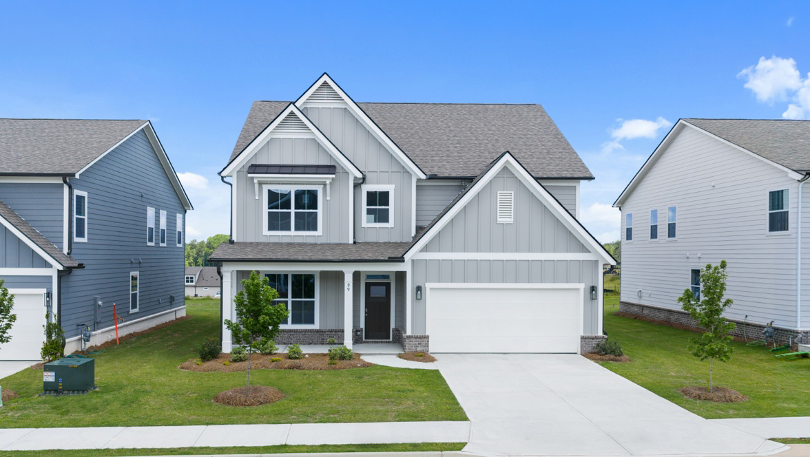 Two-story exterior home image with gray siding, white trim, and two-car garage.