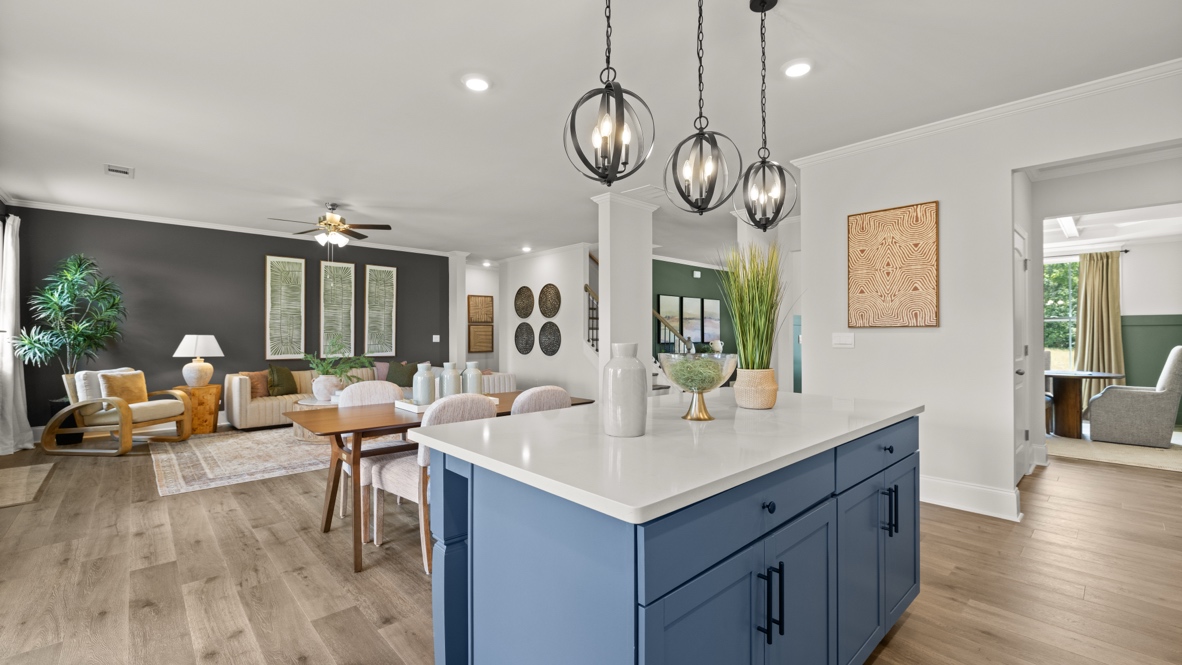 kitchen with white cabinetry, large island, and stainless steel appliances
