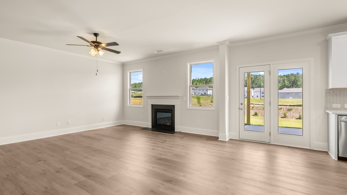 Interior living area with fire place and large windows
