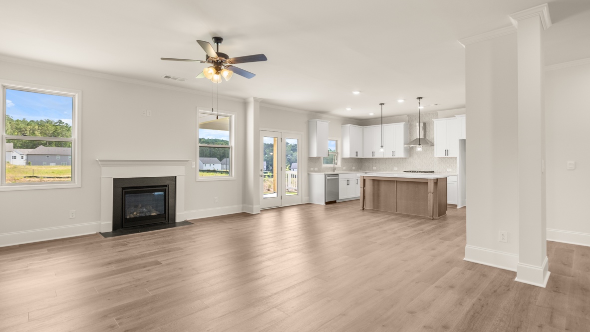 Interior living area with fire place and large windows