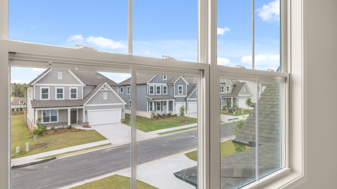 Interior primary bedroom with windows