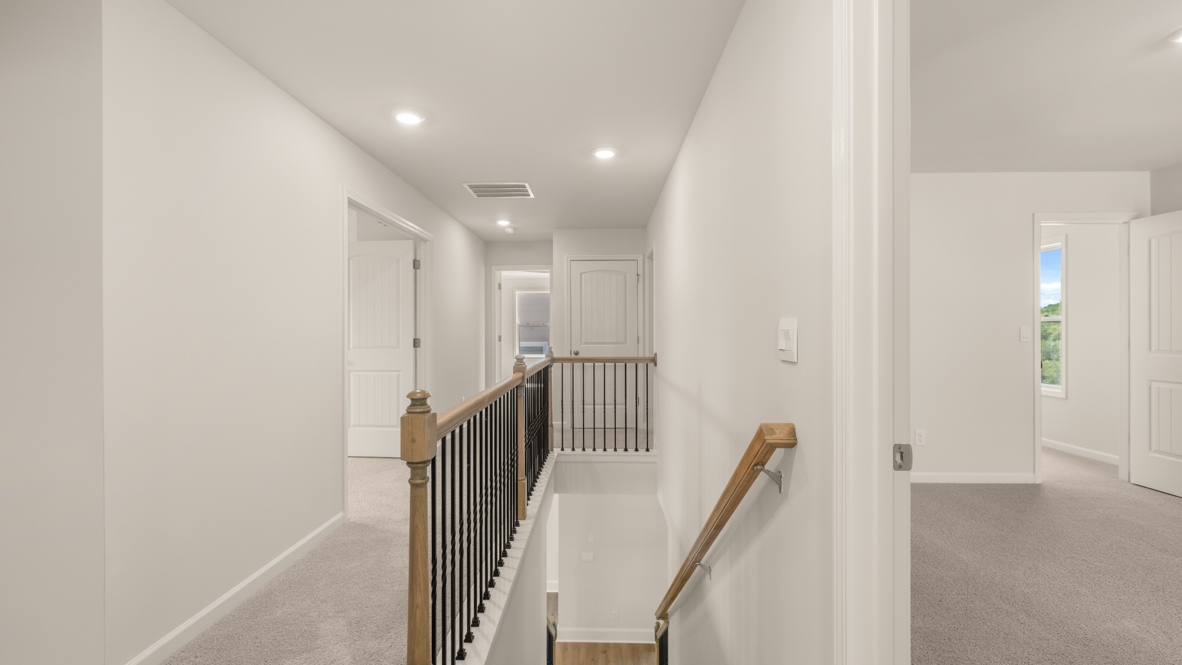 Interior upstairs loft area open to staircase