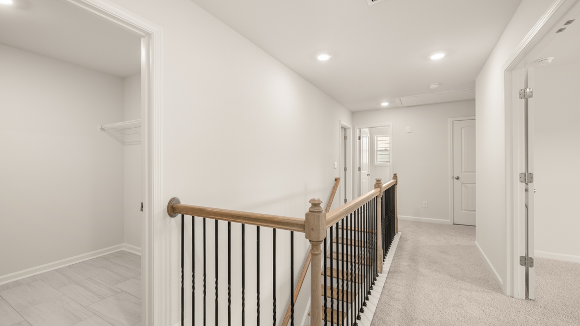 Interior upstairs loft area open to staircase