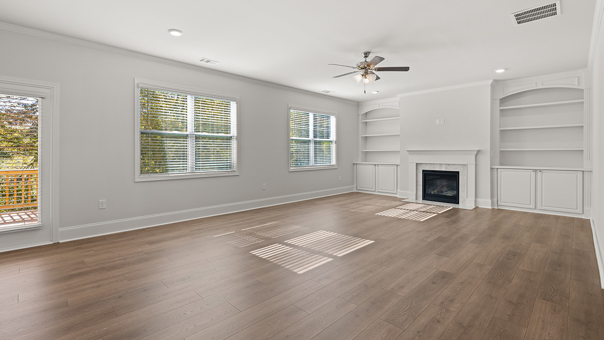 Interior living area with fire place and large windows