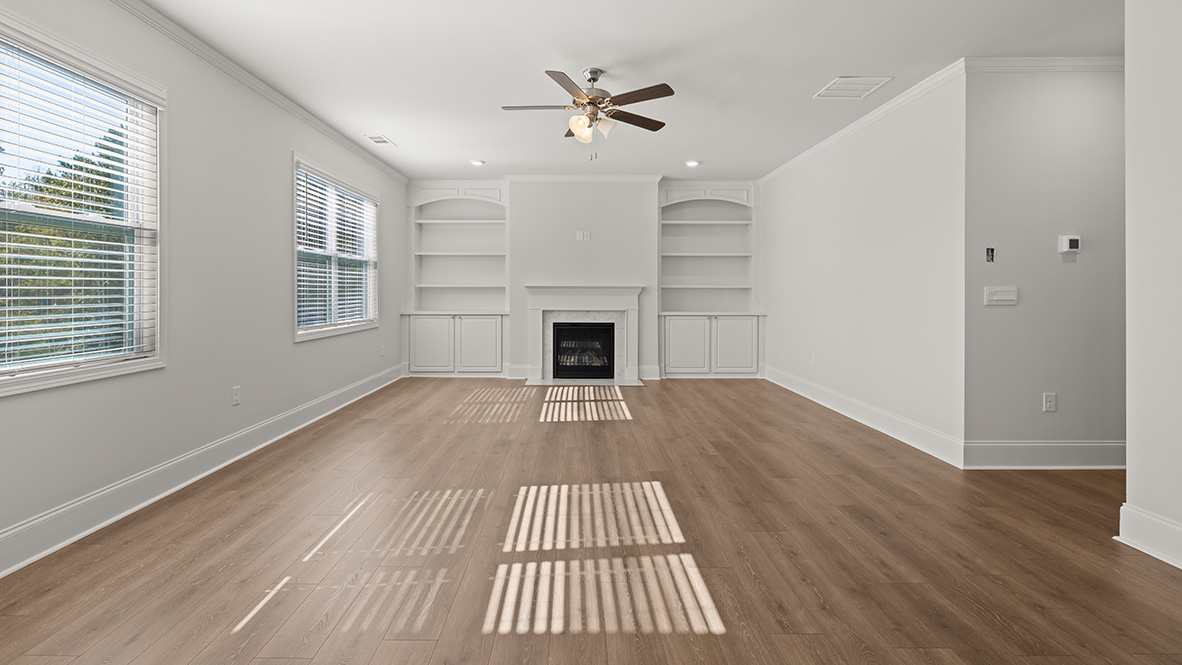 Interior living area with fire place and large windows