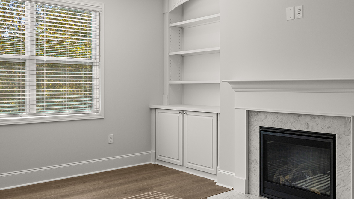 Interior living area with fire place and large windows