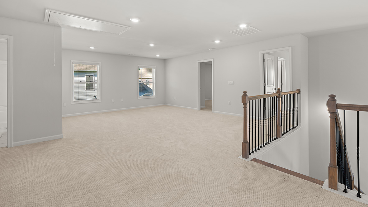 Interior upstairs loft area open to staircase