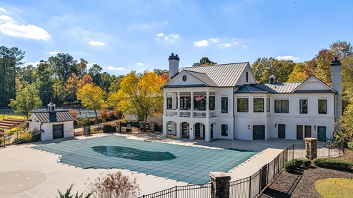 community amenity clubhouse with a pool