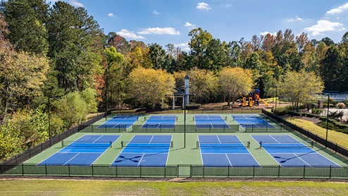 community amenity clubhouse with pickle ball courts